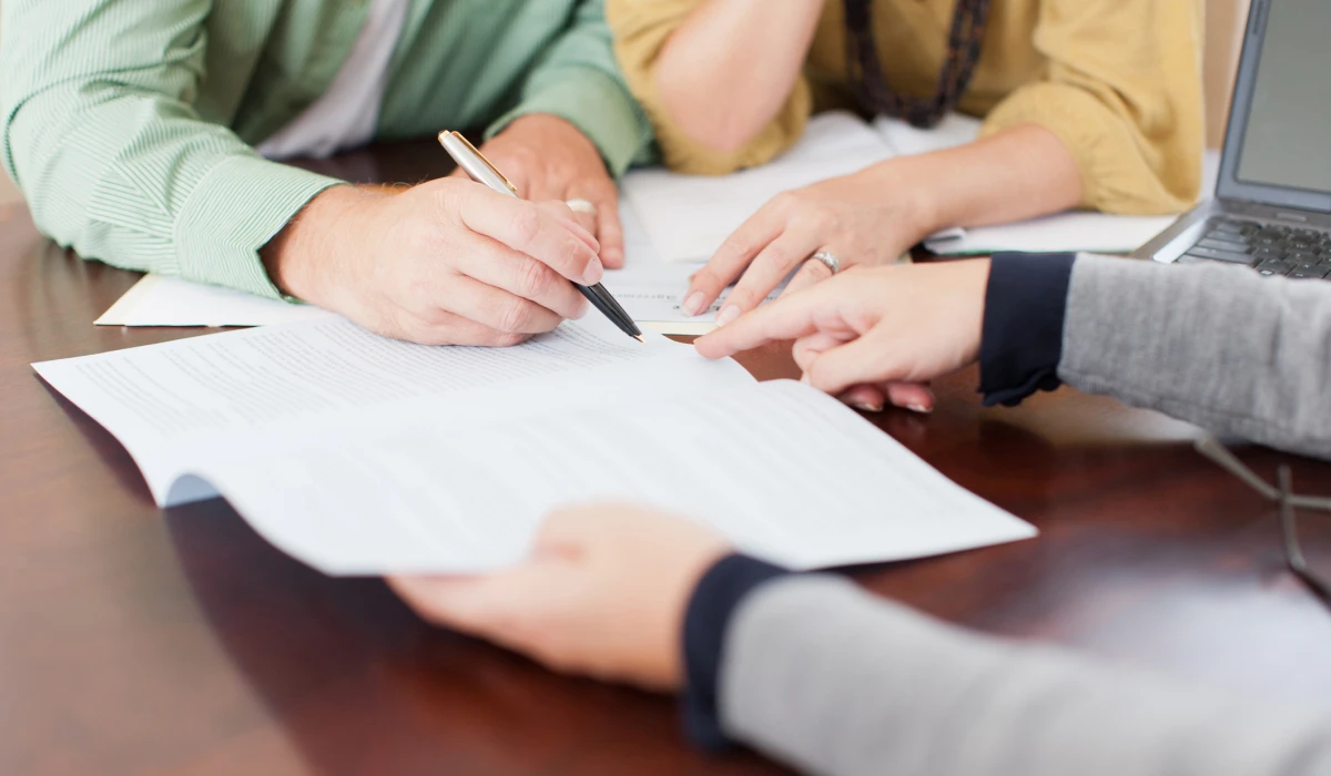 People reviewing documents at a table